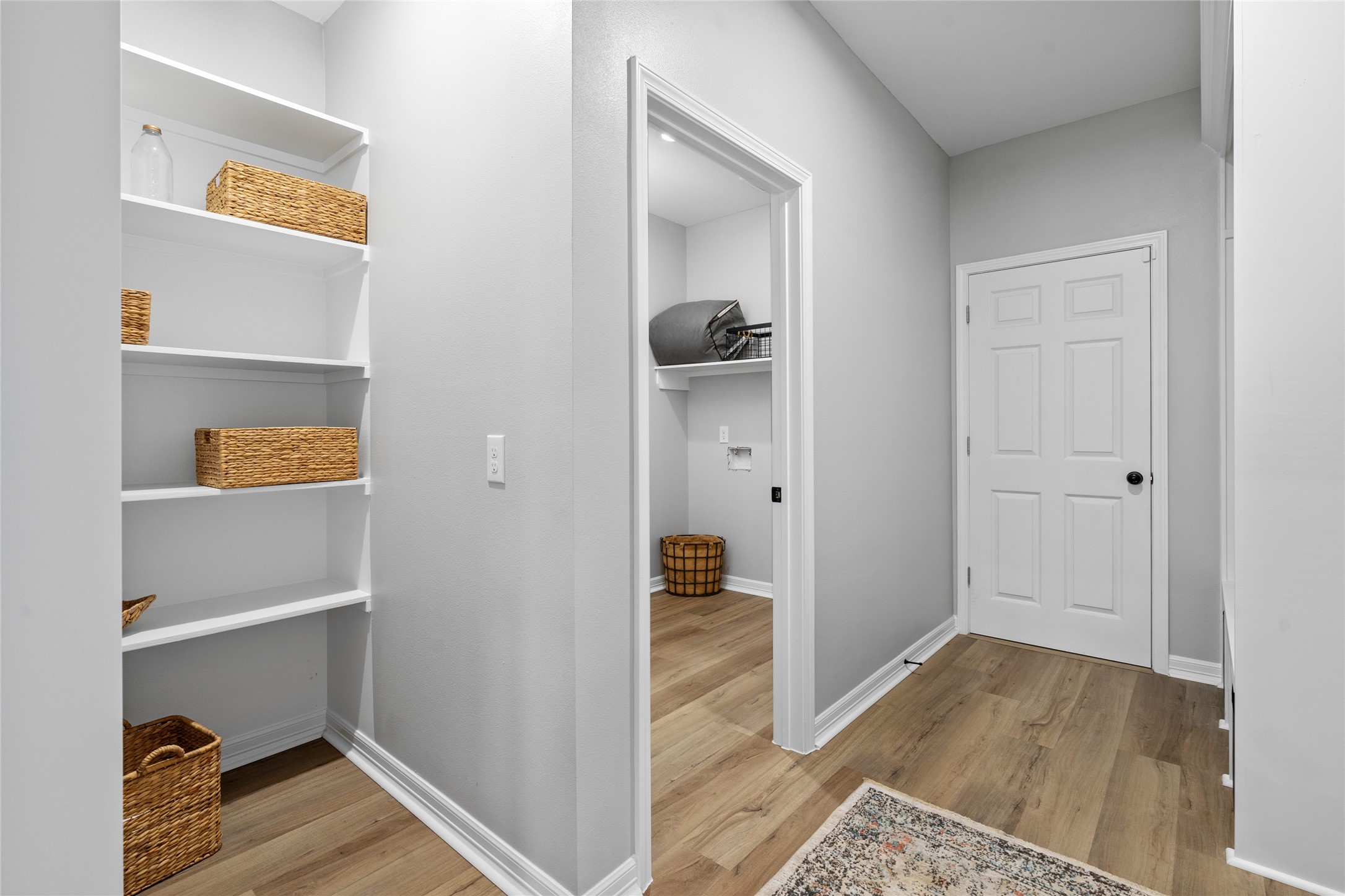 14307 Laredo Street Houston, TX 77015 - Photo 26 of 38 a view of a hallway with wooden floor and a bathroom