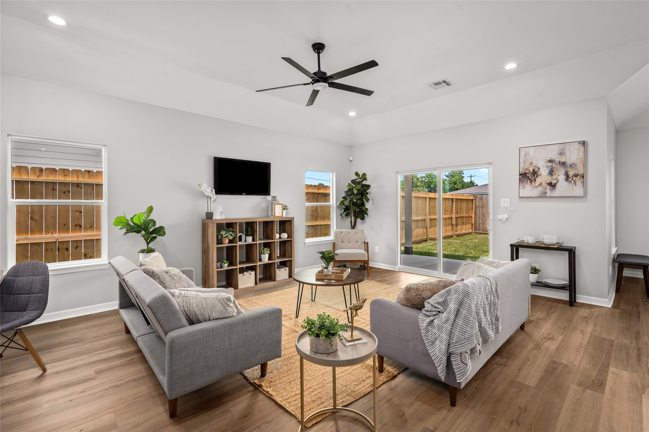 14307 Laredo Street Houston, TX 77015 - Photo 3 of 38 a living room with furniture a large window and a flat screen tv