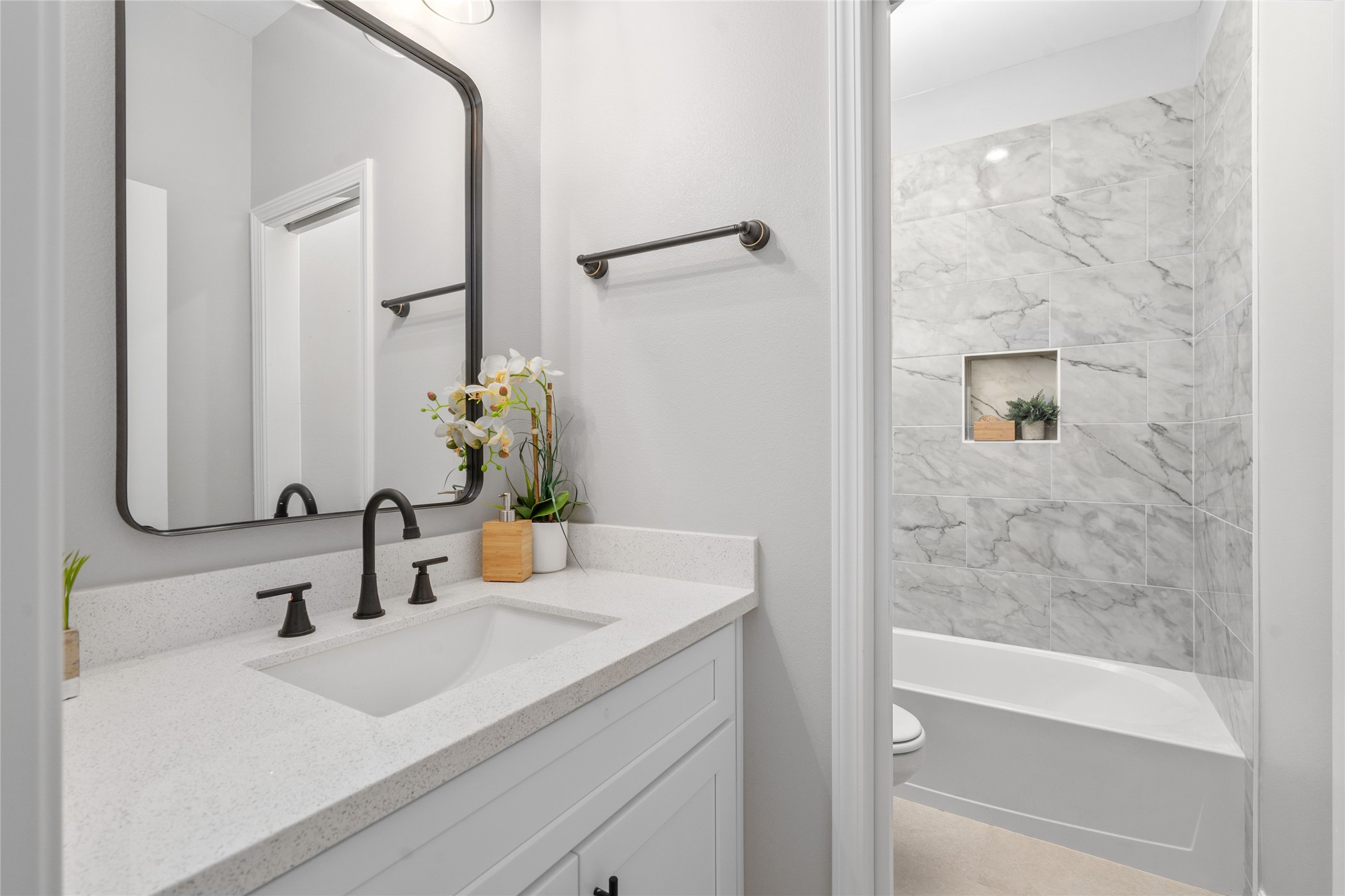 14307 Laredo Street Houston, TX 77015 - Photo 30 of 38 a bathroom with a sink and a mirror