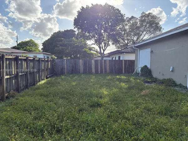 a view of backyard with green space