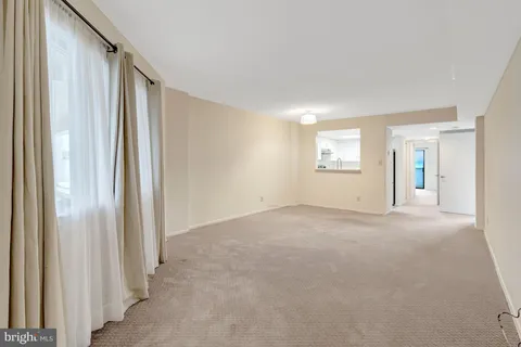 a view of an empty room and window