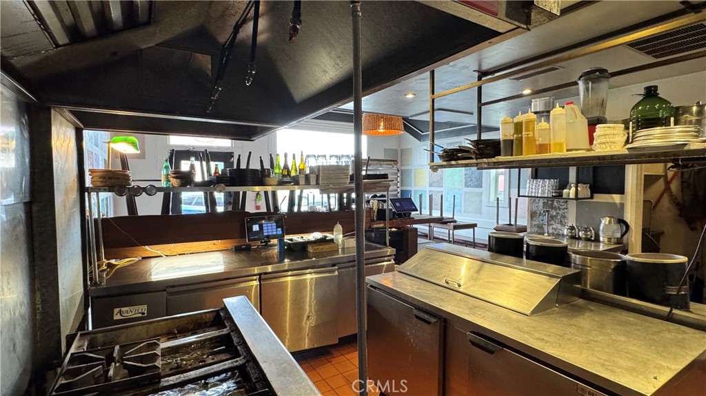 35 East Commercial Street Willits, CA 95490 - Photo 7 of 19 a kitchen with a stove and a microwave