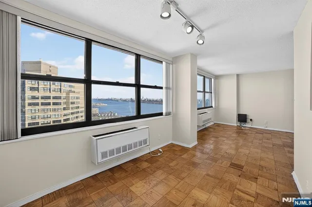 a view of a kitchen with an oven and refrigerator