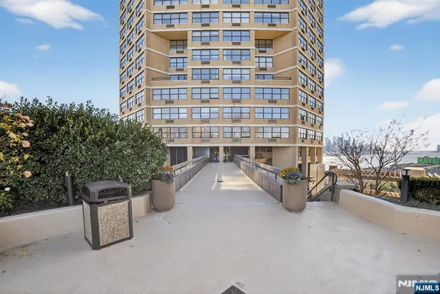 a view of swimming pool with outdoor seating and yard