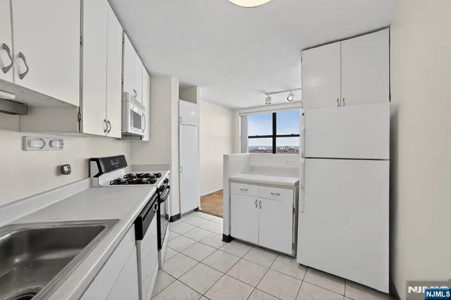 a bathroom with a toilet and shower