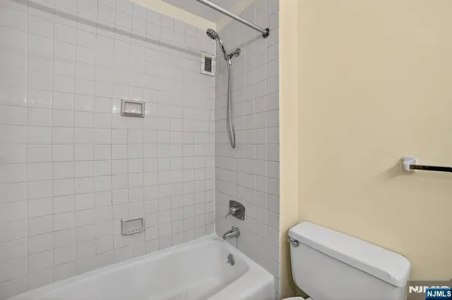 a room with furniture and pool table