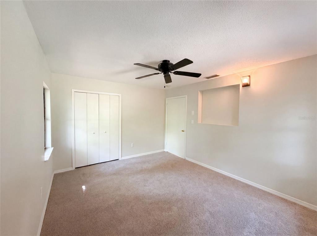 3739 Lake Griffin Road Lady Lake, FL 32159 - Photo 19 of 21 a view of a room with a ceiling fan