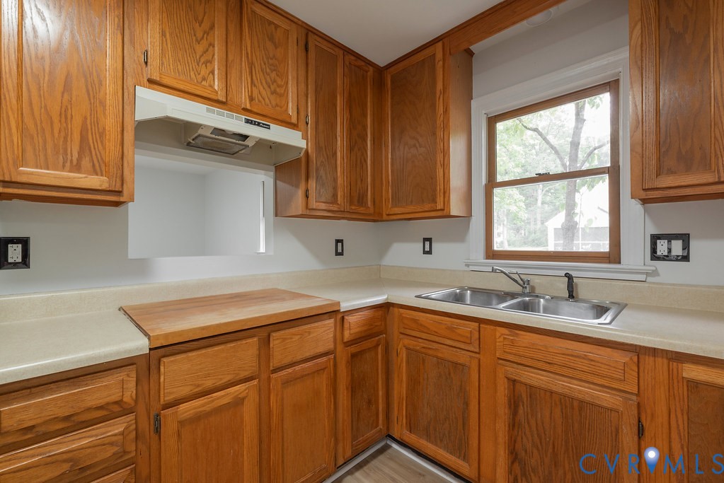 11840 Winfore Drive Midlothian, VA 23113 - Photo 25 of 40 Kitchen featuring wood cabinetry, light countertop