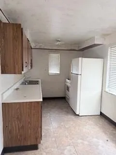 a utility room with a sink washer and dryer