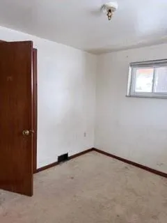 a view of an empty room and window