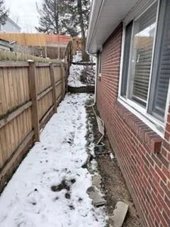 a view of a backyard with pathway