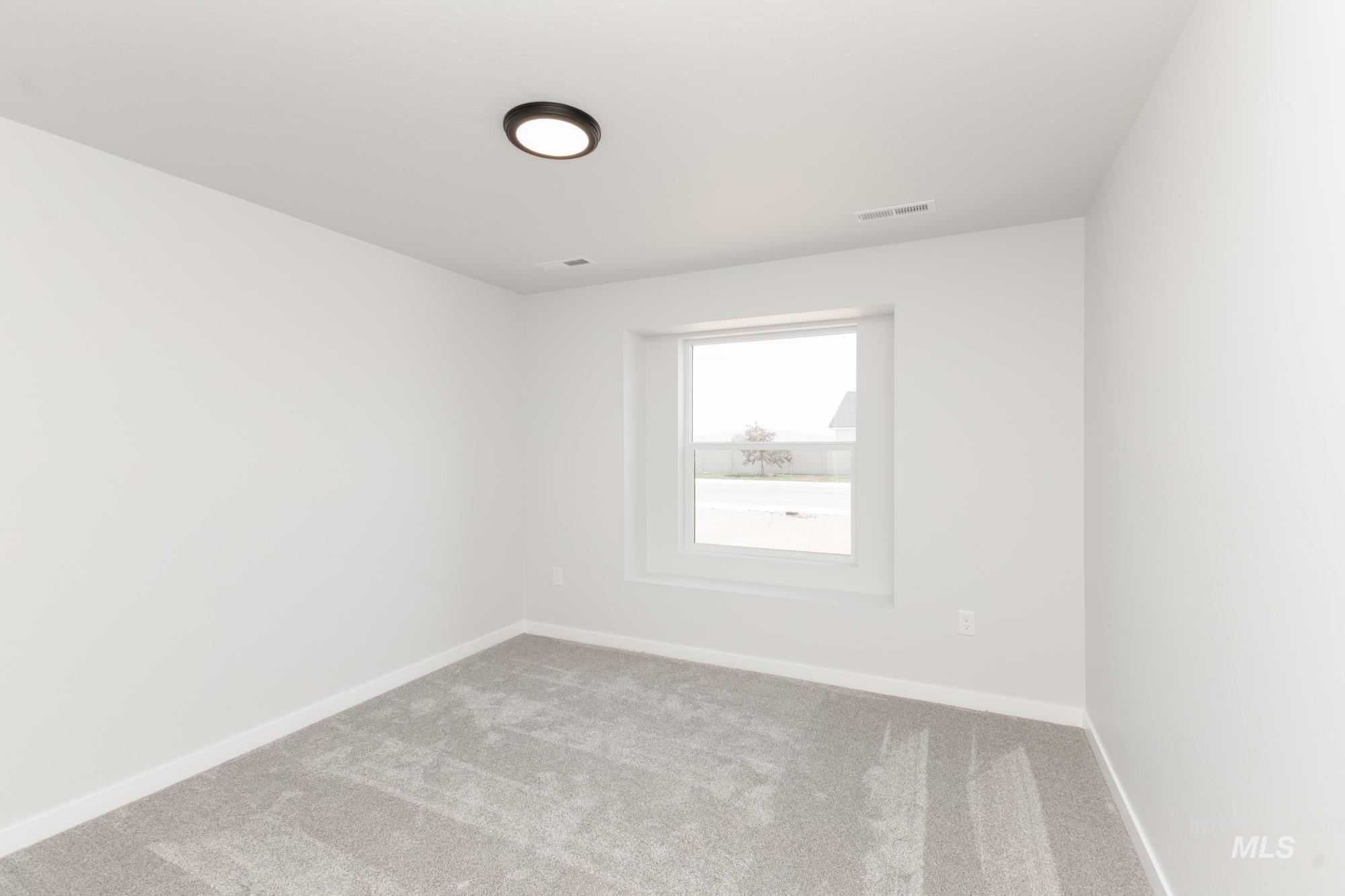 13678 Nisene Street Caldwell, ID 83607 - Photo 9 of 19 Empty room featuring baseboards and carpet flooring
