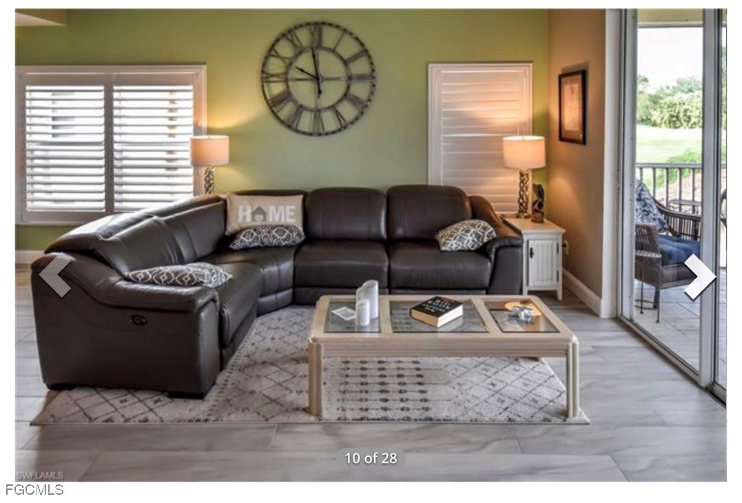 14971 Rivers Edge Court, Unit 201 Fort Myers, FL 33908 - Photo 4 of 8 a living room with furniture a rug and a window