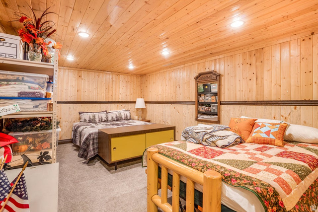 48 South Sage Road Pine Valley, UT 84781 - Photo 44 of 61 Wood-paneled walls and ceiling creating a rustic ambiance, complemented by recessed lighting and a carpeted floor