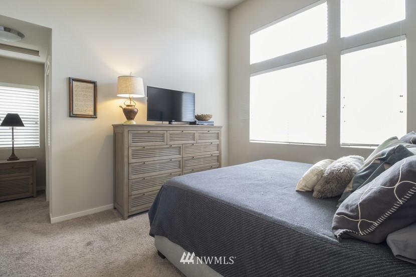 4520 Northeast 3rd Lane Renton, WA 98059 - Photo 12 of 20 a bedroom with a bed and a television
