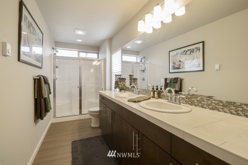 4520 Northeast 3rd Lane Renton, WA 98059 - Photo 13 of 20 a bathroom with a sink a toilet and a mirror
