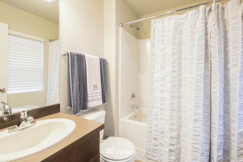 4520 Northeast 3rd Lane Renton, WA 98059 - Photo 15 of 20 a bathroom with a sink toilet and shower