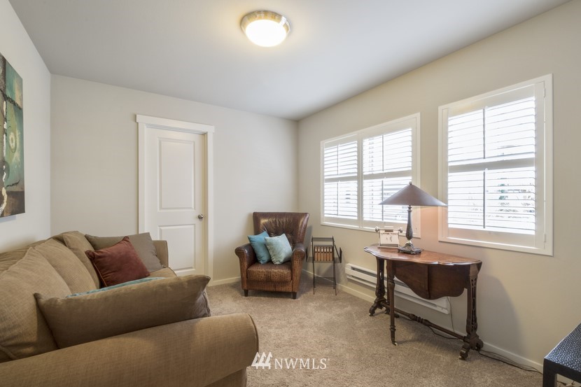4520 Northeast 3rd Lane Renton, WA 98059 - Photo 16 of 20 a living room with furniture and a window
