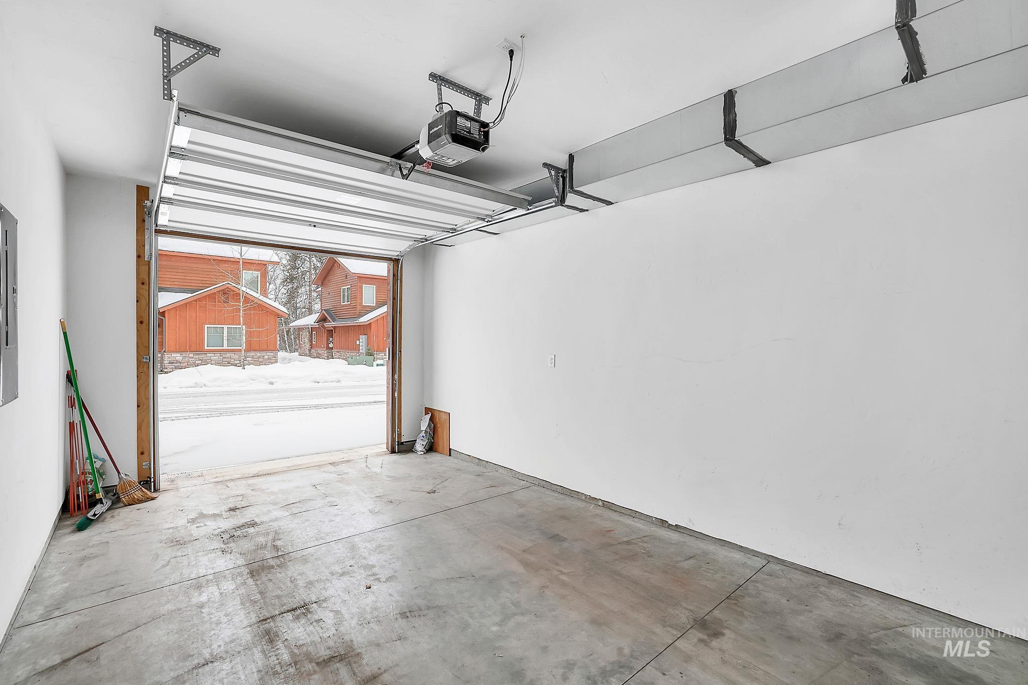 609 Blue Water Circle McCall, ID 83638 - Photo 41 of 45 Garage with a garage door opener
