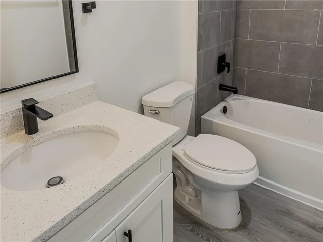 a bathroom with a sink and toilet