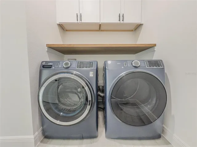 a utility room with dryer and washer
