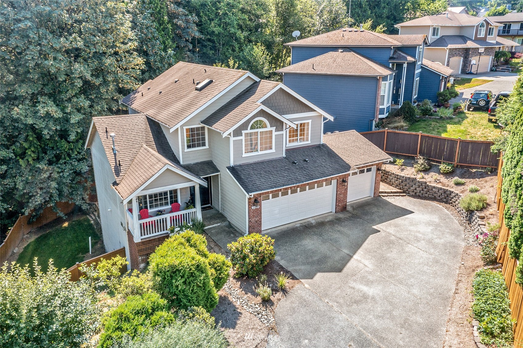 23009 21st Avenue Southeast Bothell, WA 98021 - Photo 1 of 40 a aerial view of a house with a yard and potted plants