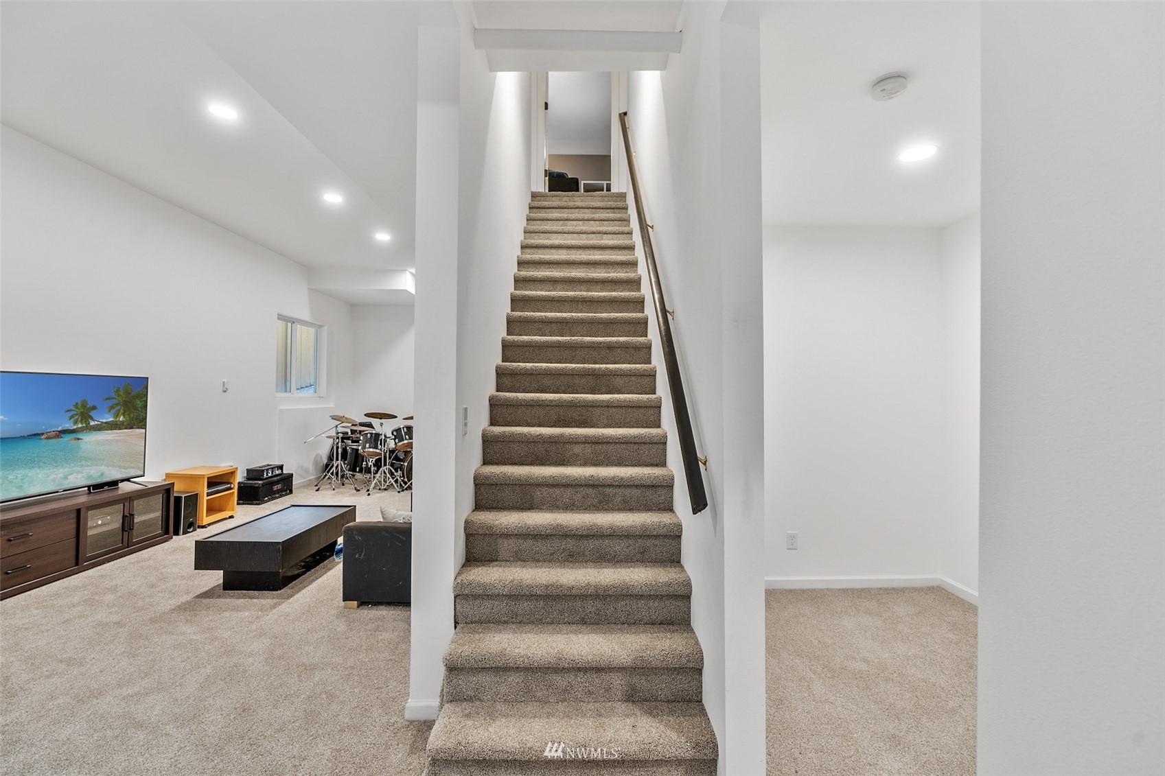 23009 21st Avenue Southeast Bothell, WA 98021 - Photo 29 of 40 a hallway with stairs and a livingroom with furniture