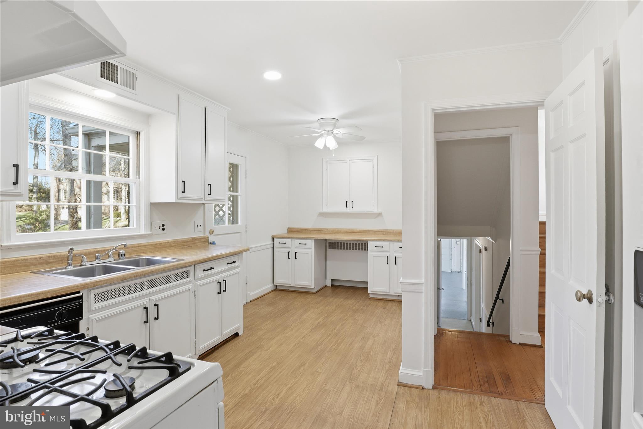 3701 Pine Brook Road Alexandria, VA 22310 - Photo 11 of 78 a kitchen with a sink stove and cabinets