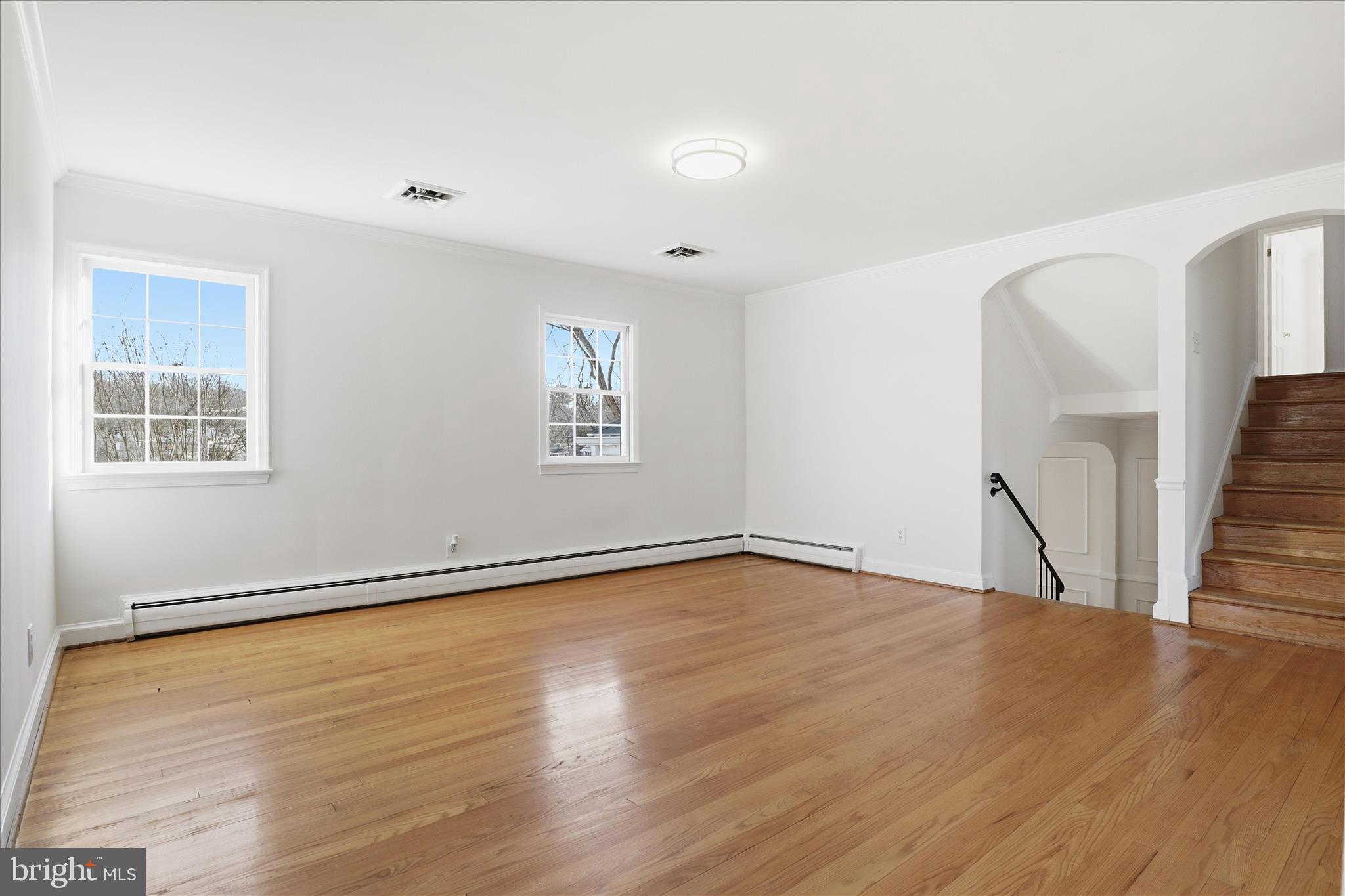 3701 Pine Brook Road Alexandria, VA 22310 - Photo 15 of 78 a view of an empty room with wooden floor and a window