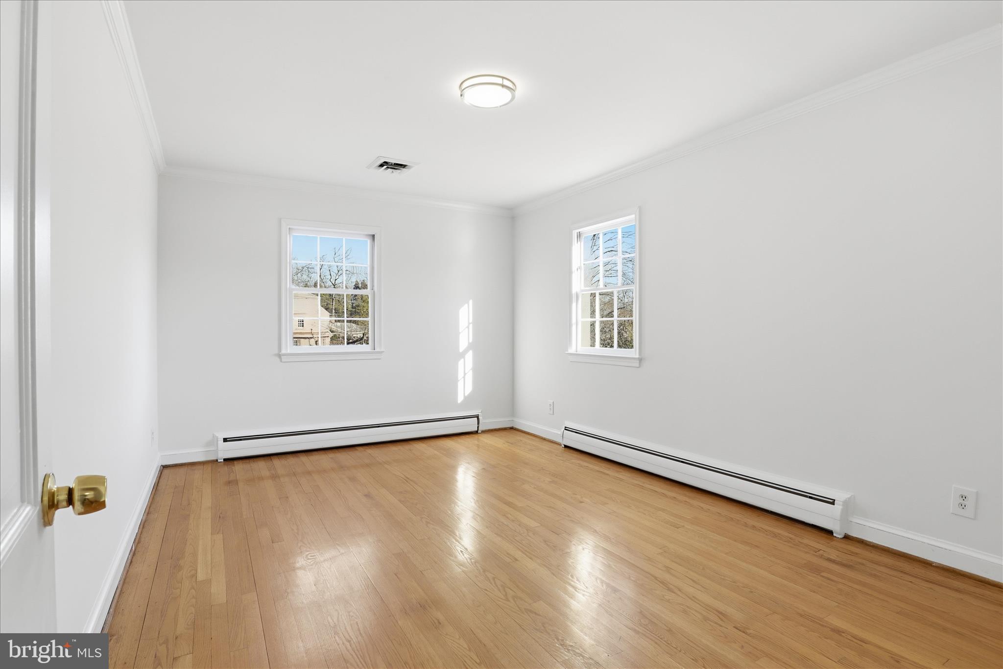 3701 Pine Brook Road Alexandria, VA 22310 - Photo 20 of 78 an empty room with a wooden floor and windows