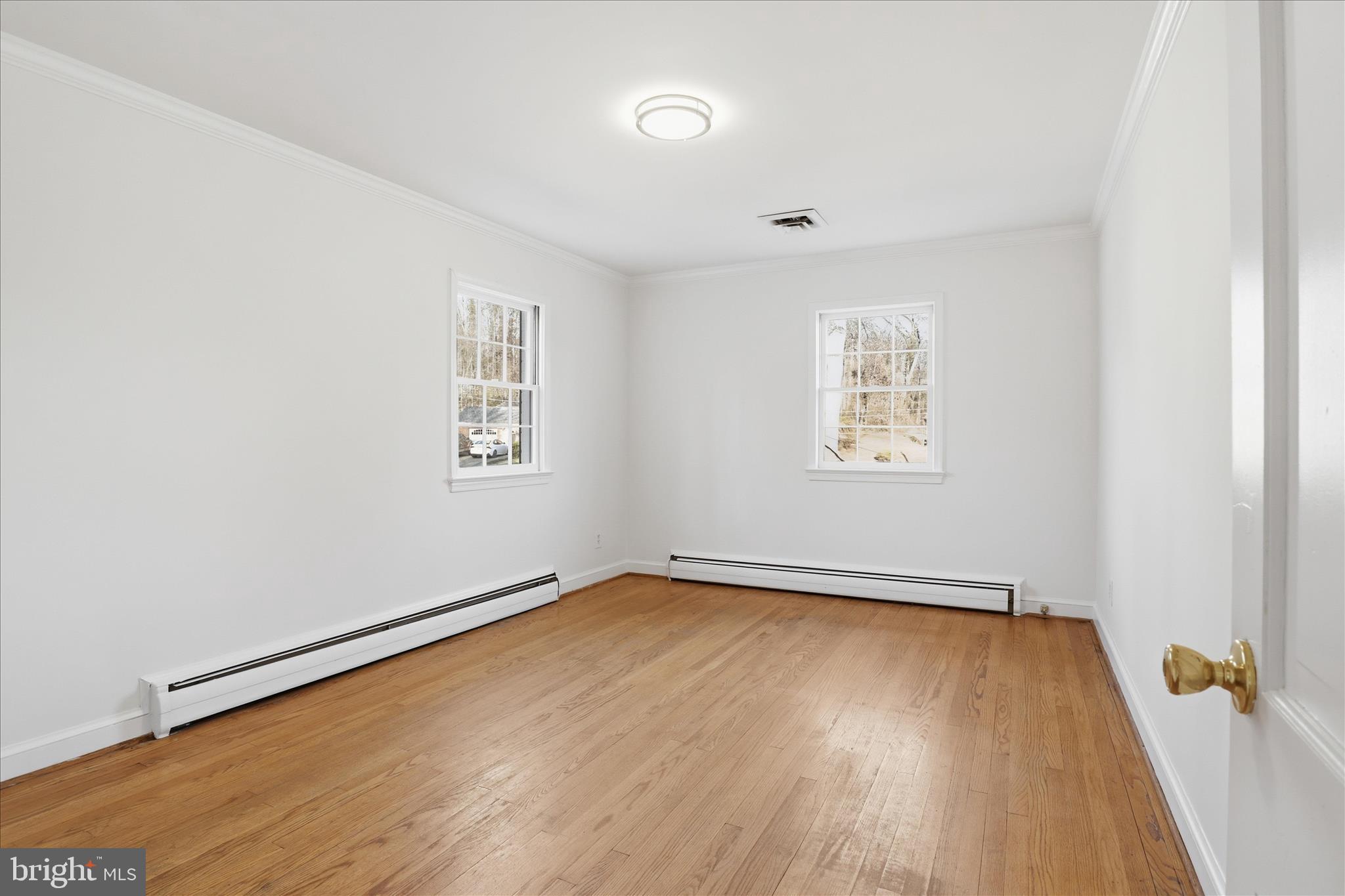 3701 Pine Brook Road Alexandria, VA 22310 - Photo 23 of 78 an empty room with wooden floor and windows