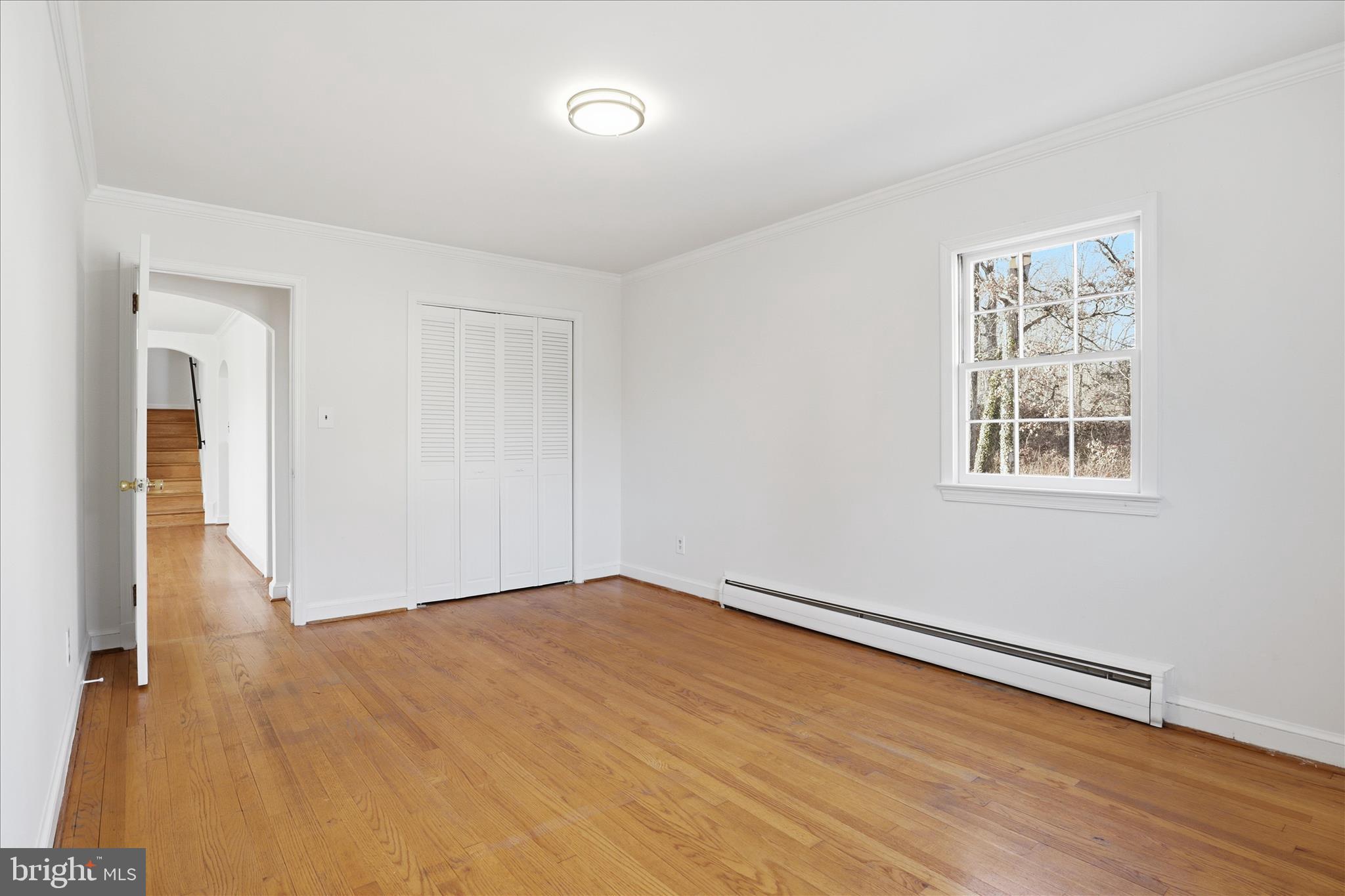 3701 Pine Brook Road Alexandria, VA 22310 - Photo 25 of 78 a view of an empty room with wooden floor and a window