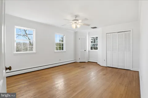 a bathroom with a sink toilet and mirror