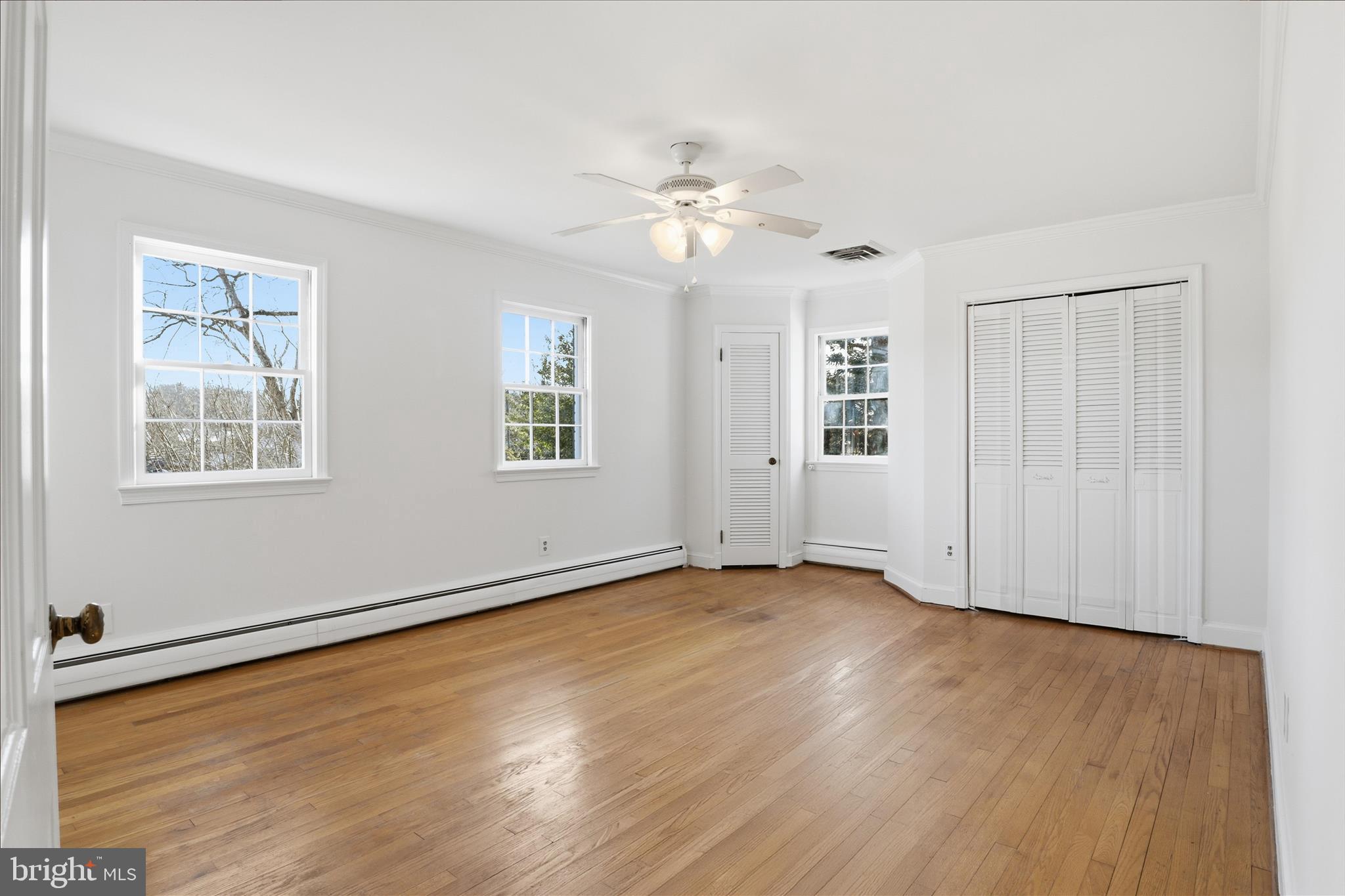 3701 Pine Brook Road Alexandria, VA 22310 - Photo 28 of 78 a view of an empty room with wooden floor and a window