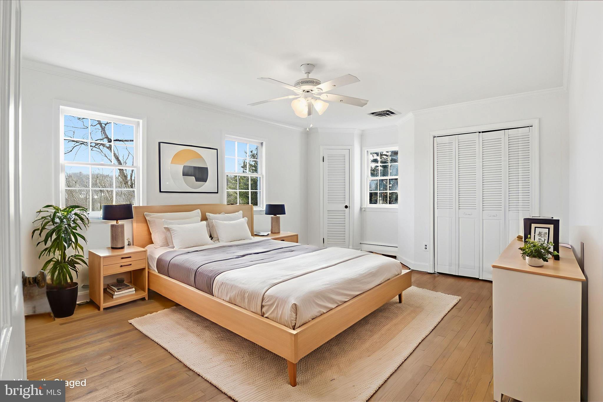 3701 Pine Brook Road Alexandria, VA 22310 - Photo 29 of 78 a bedroom with a large bed and a chandelier