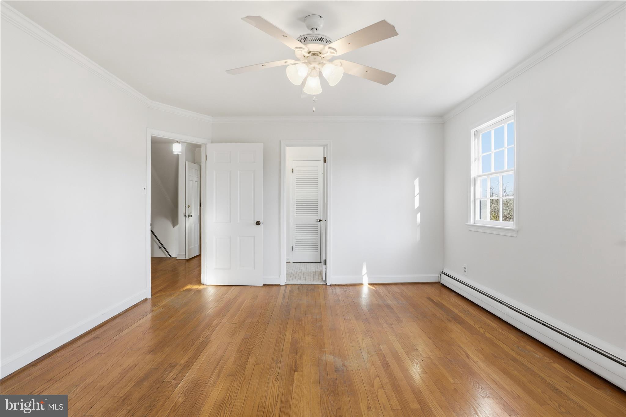 3701 Pine Brook Road Alexandria, VA 22310 - Photo 30 of 78 wooden floor in an empty room with a window