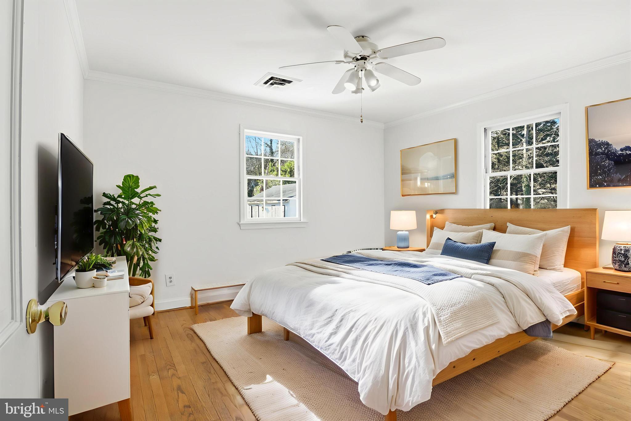 3701 Pine Brook Road Alexandria, VA 22310 - Photo 33 of 78 a bedroom with a bed and a potted plant