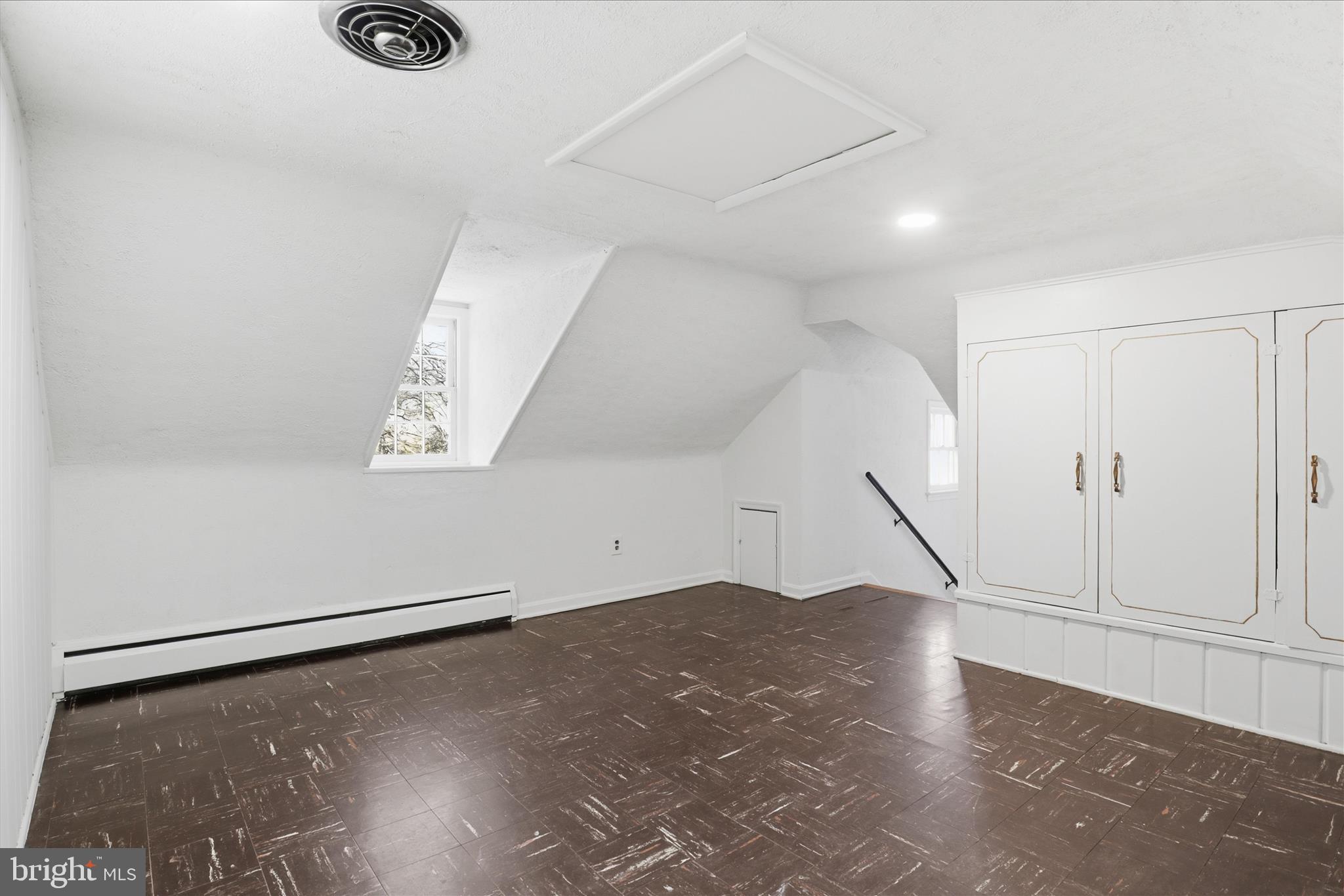 3701 Pine Brook Road Alexandria, VA 22310 - Photo 42 of 78 an empty room with wooden floor and white walls