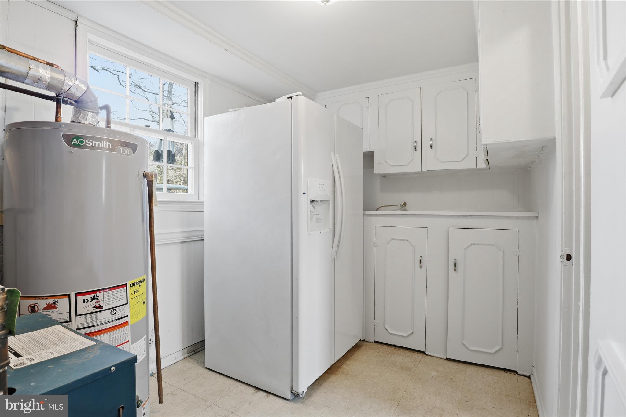 3701 Pine Brook Road Alexandria, VA 22310 - Photo 47 of 78 a white refrigerator freezer sitting in a kitchen