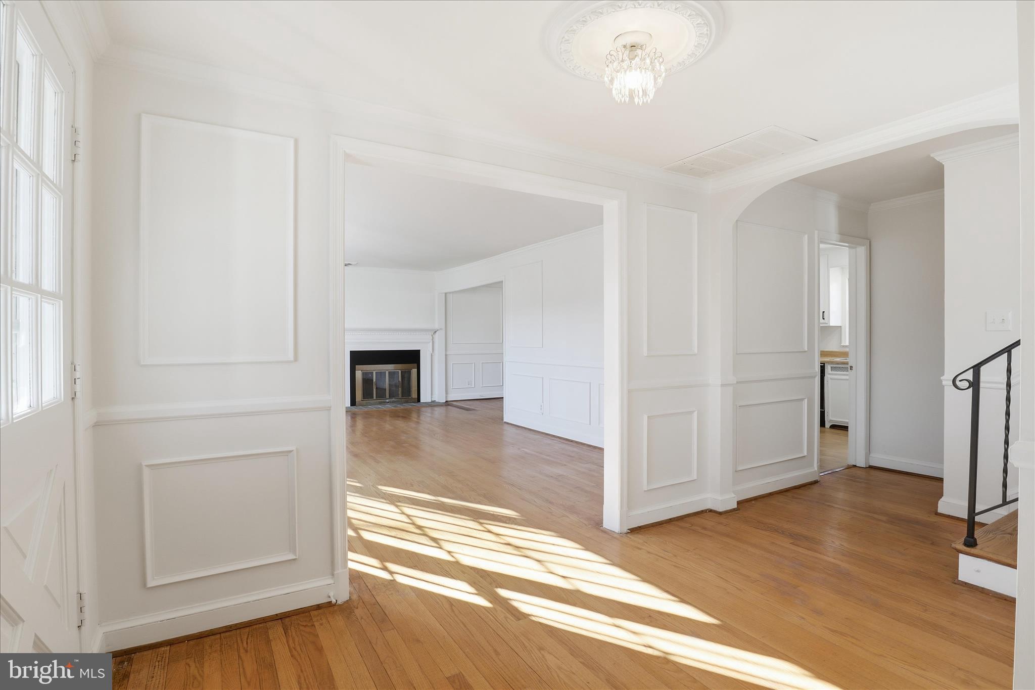 3701 Pine Brook Road Alexandria, VA 22310 - Photo 5 of 78 an empty room with wooden floor cabinet and windows