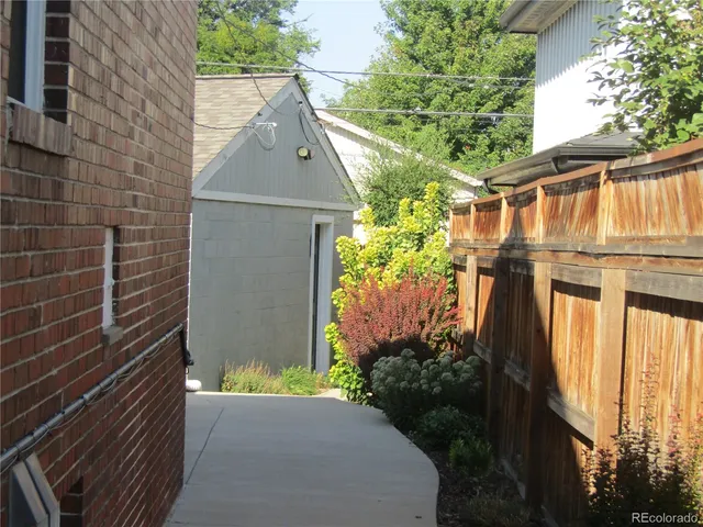 a view of a house with brick walls