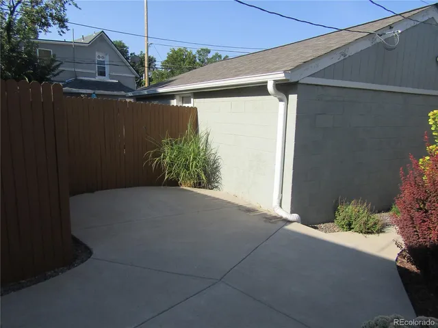 a potted plant sitting in front of a house