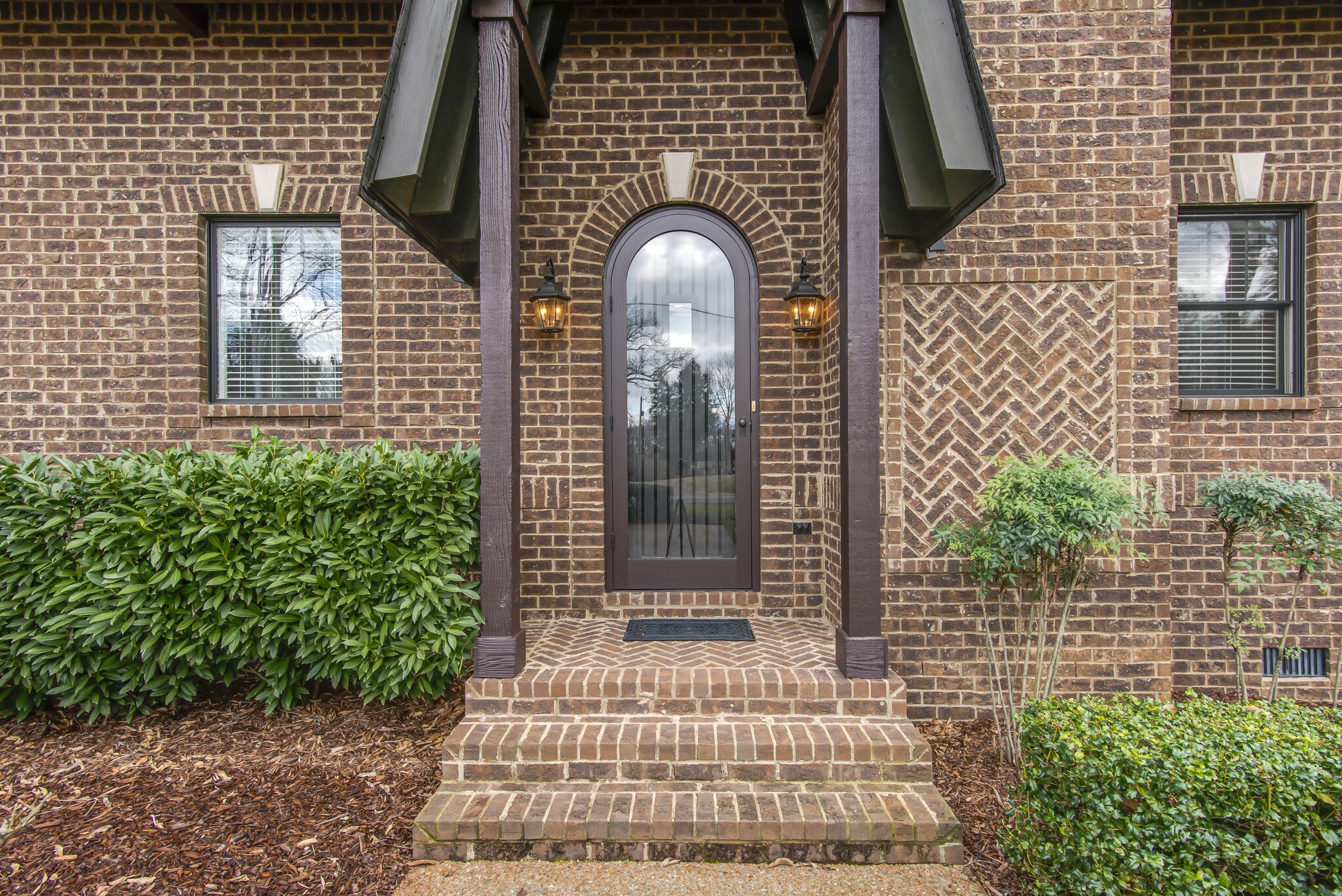 706 Crescent Road Nashville, TN 37205 - Photo 2 of 27 a front view of a house with a garden