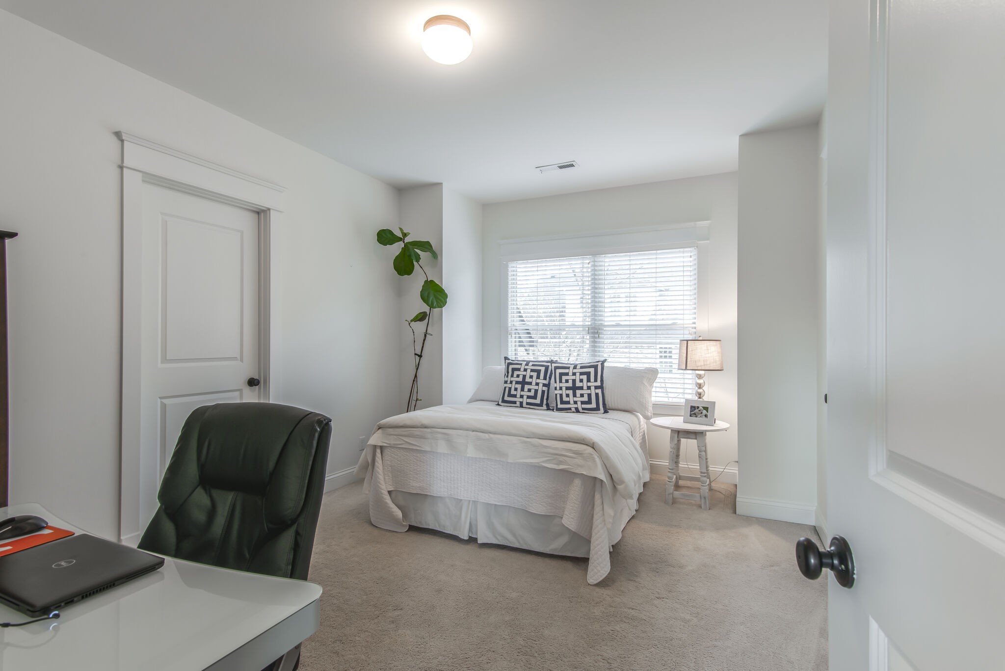 706 Crescent Road Nashville, TN 37205 - Photo 20 of 27 a bedroom with a bed and a chair