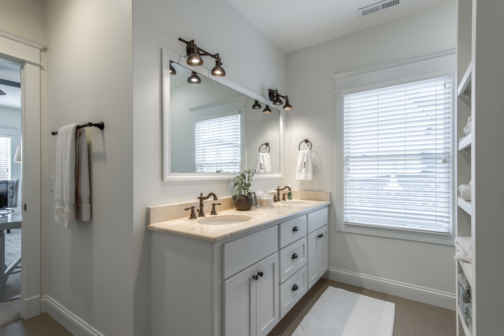706 Crescent Road Nashville, TN 37205 - Photo 21 of 27 a bathroom with a double vanity sink a mirror and a shower