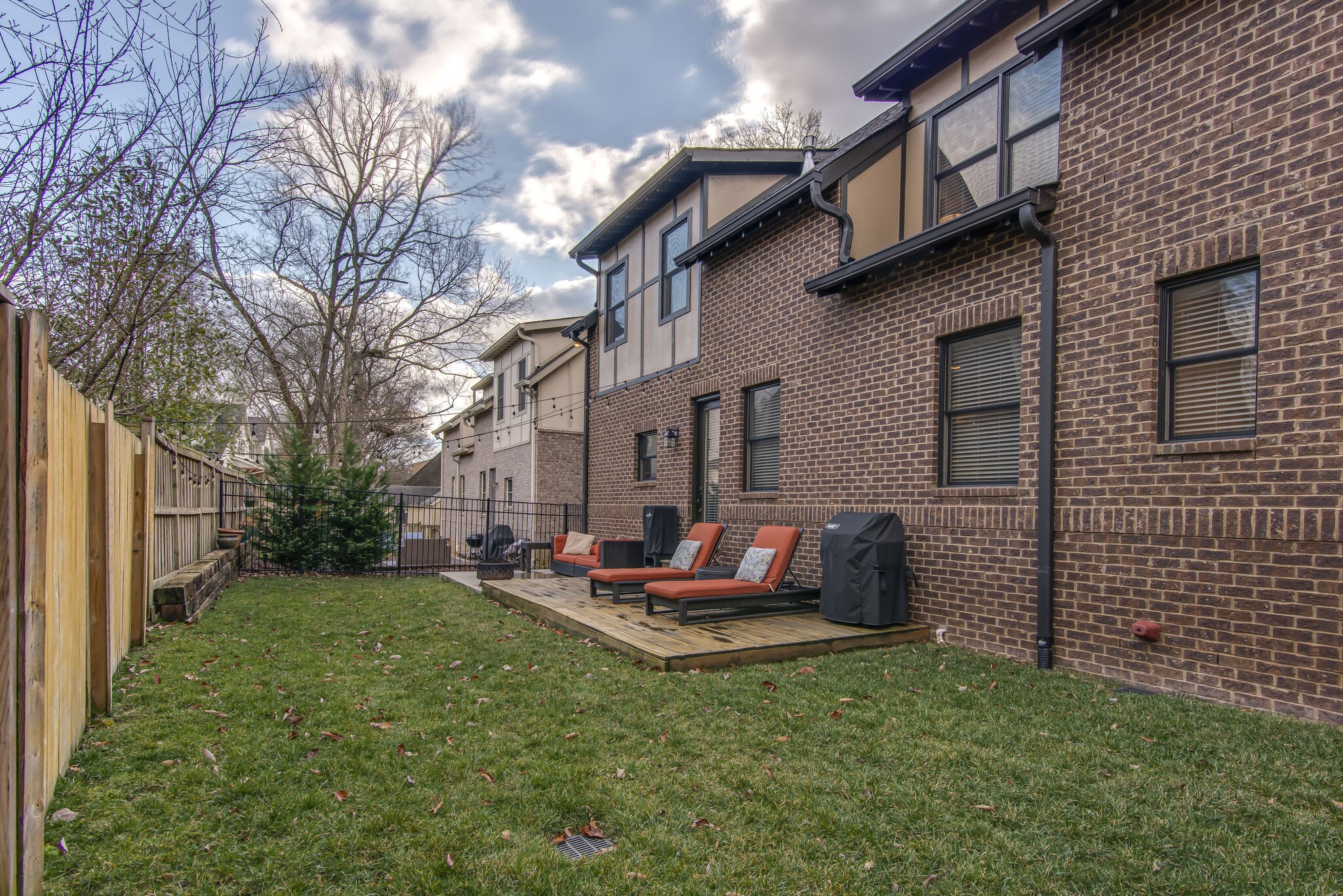 706 Crescent Road Nashville, TN 37205 - Photo 26 of 27 a backyard of a house with table and chairs