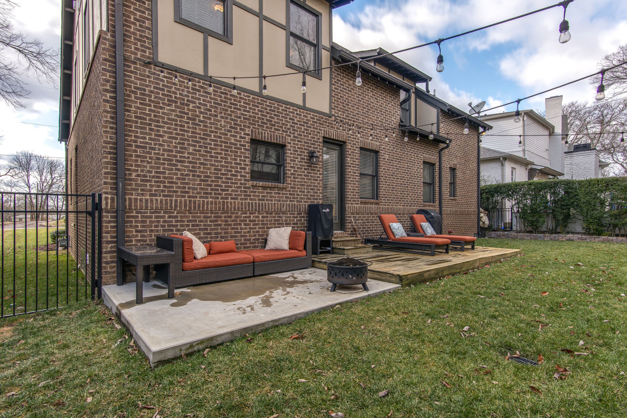 706 Crescent Road Nashville, TN 37205 - Photo 27 of 27 a view of a patio with a dining table and chairs with wooden floor