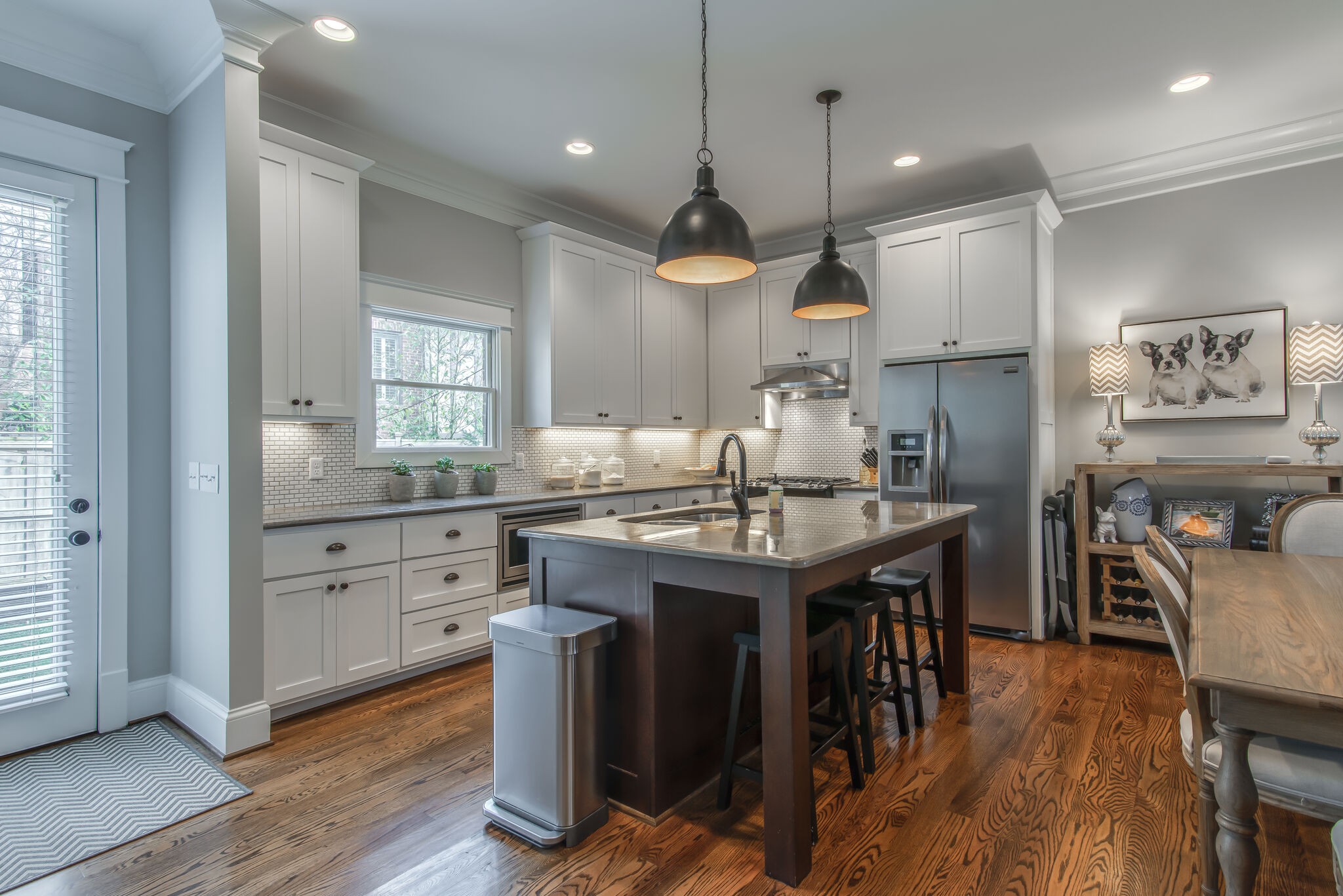 706 Crescent Road Nashville, TN 37205 - Photo 7 of 27 a kitchen with kitchen island a wooden floor and white appliances
