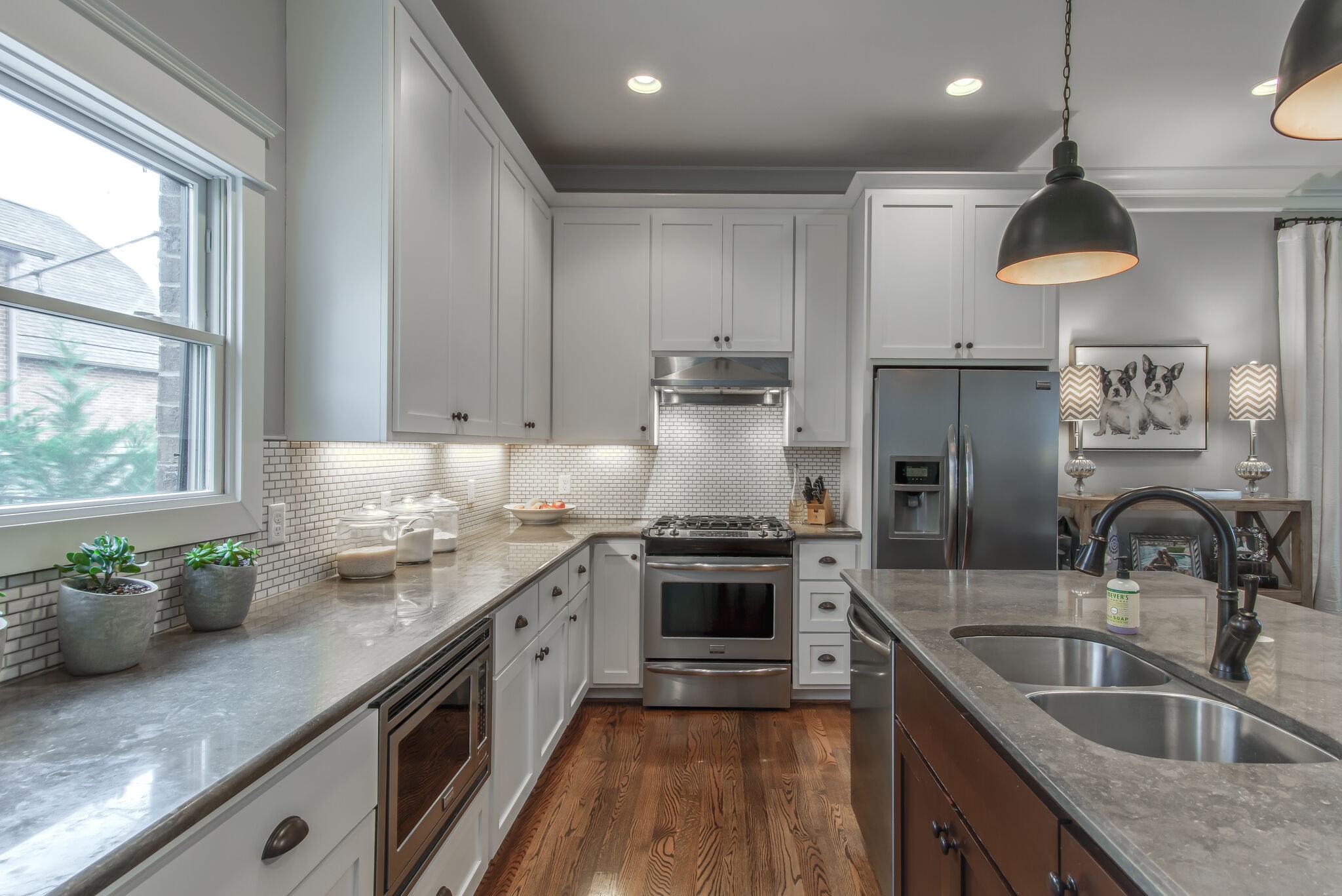 706 Crescent Road Nashville, TN 37205 - Photo 8 of 27 a kitchen with stainless steel appliances granite countertop a sink a stove and a wooden floors