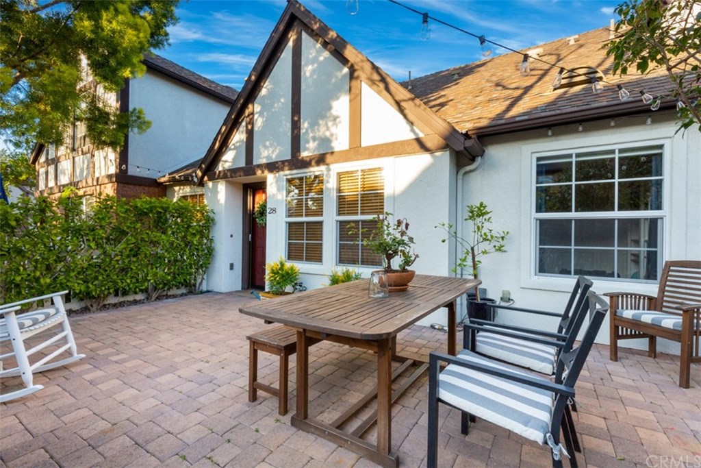 Welcome to the cutest home on the market! This wonderful courtyard enclosed by greenery is perfect for entertaining.
